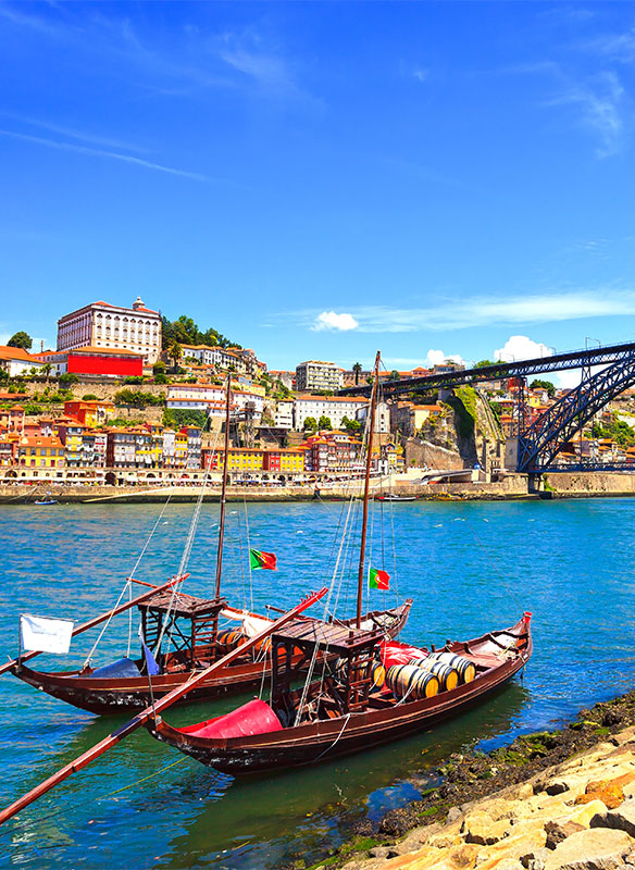 Oporto, Douro river, boats and iron bridge, Portugal