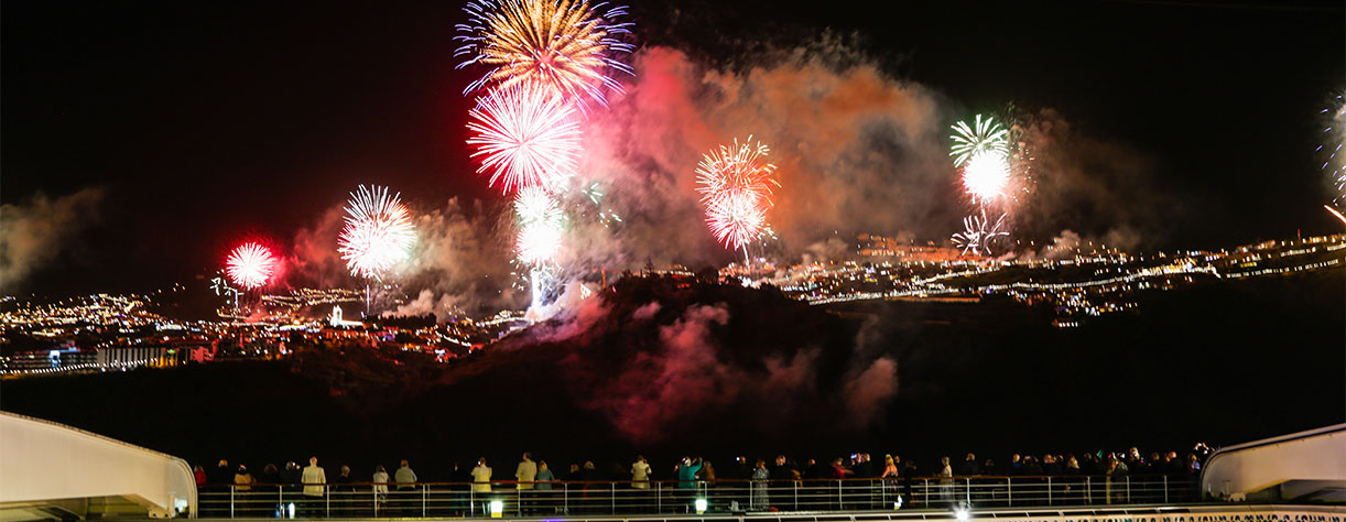 Guests watching fireworks from deck, Funchal, Portugal
