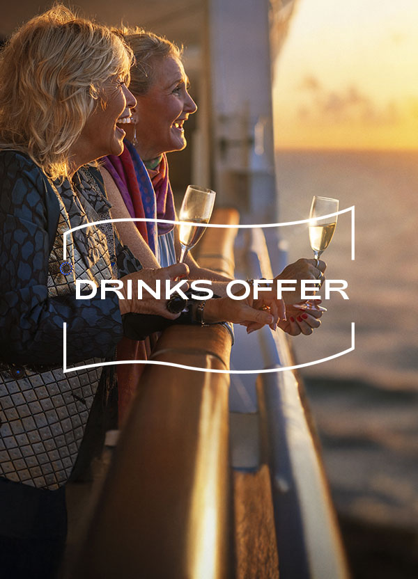 Guests enjoying drinks on deck at sunset, enjoy half price drinks
