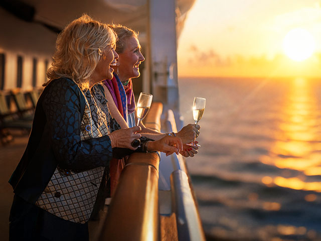 Guests enjoying drinks on deck