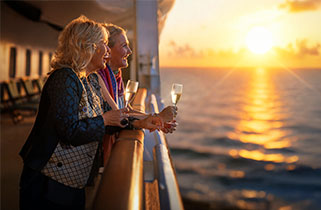 Guests enjoying drinks on deck