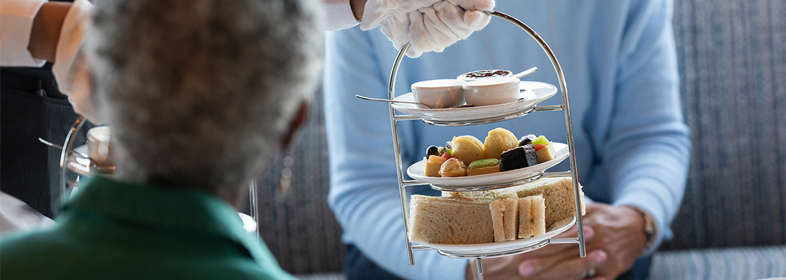 Traditional afternoon tea being served to guests