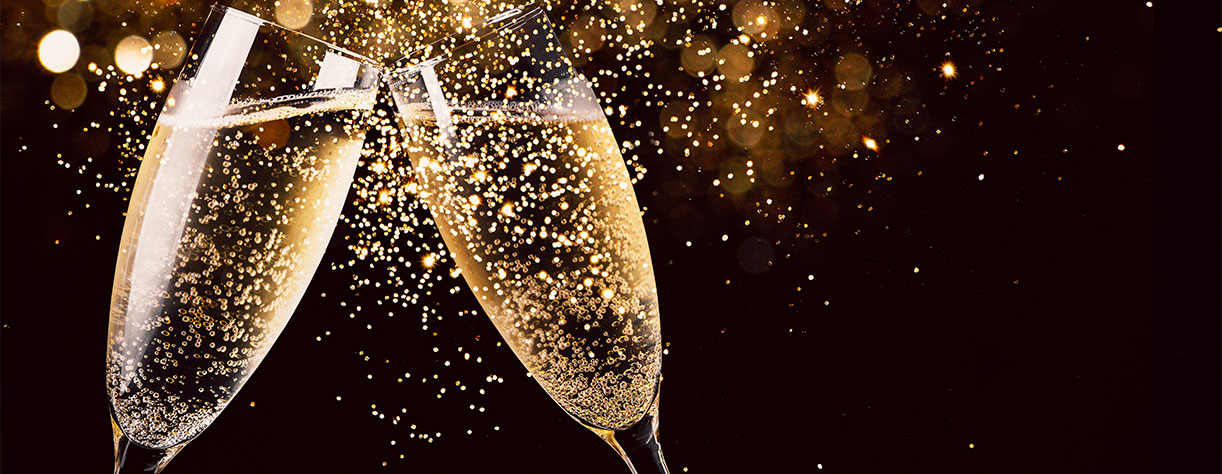 Two glasses of champagne toasting