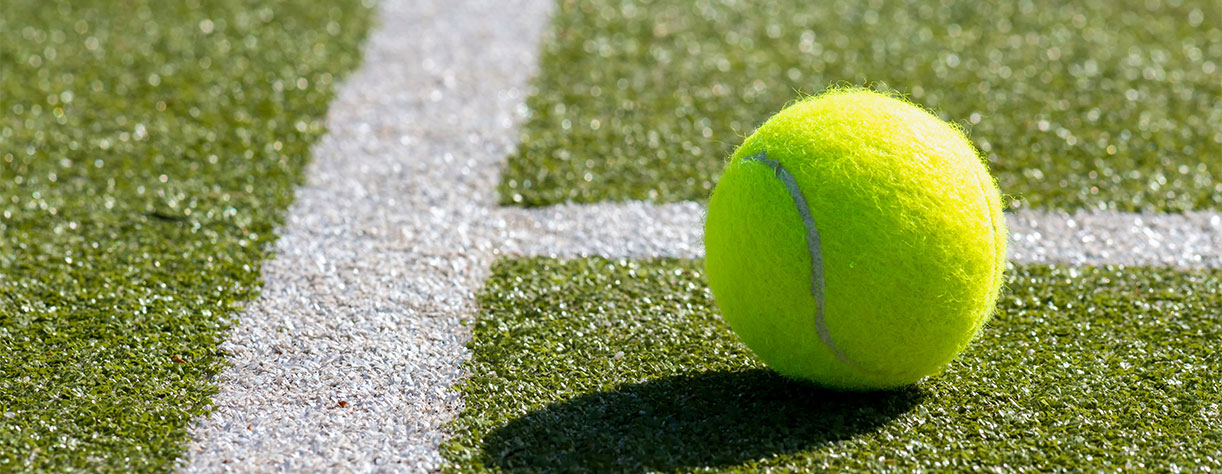 Close-up shots of tennis balls in tennis courts 