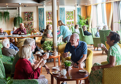 Guests enjoying coffee in the Botanical room