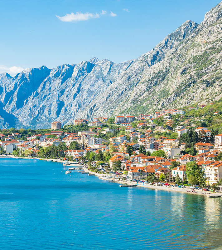 Views of Kotor Bay with high mountains and historic town, Montenegro
