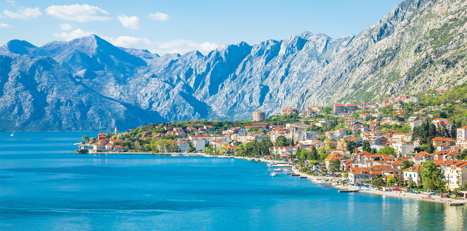 Views of Kotor Bay with high mountains and historic town, Montenegro