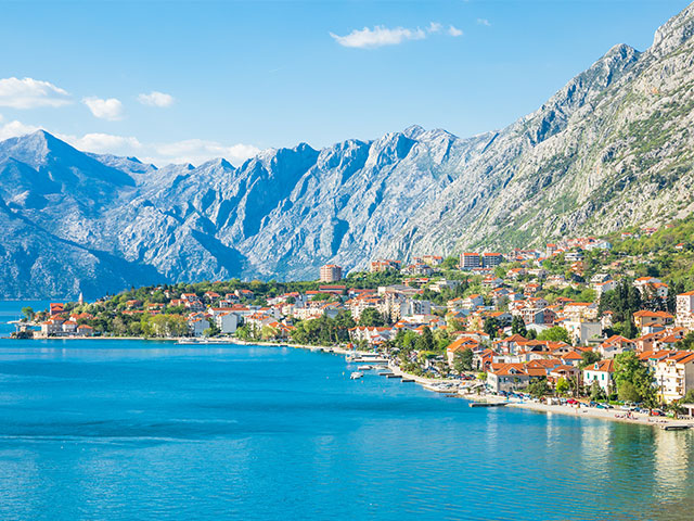 Views of Kotor Bay with high mountains and historic town, Montenegro