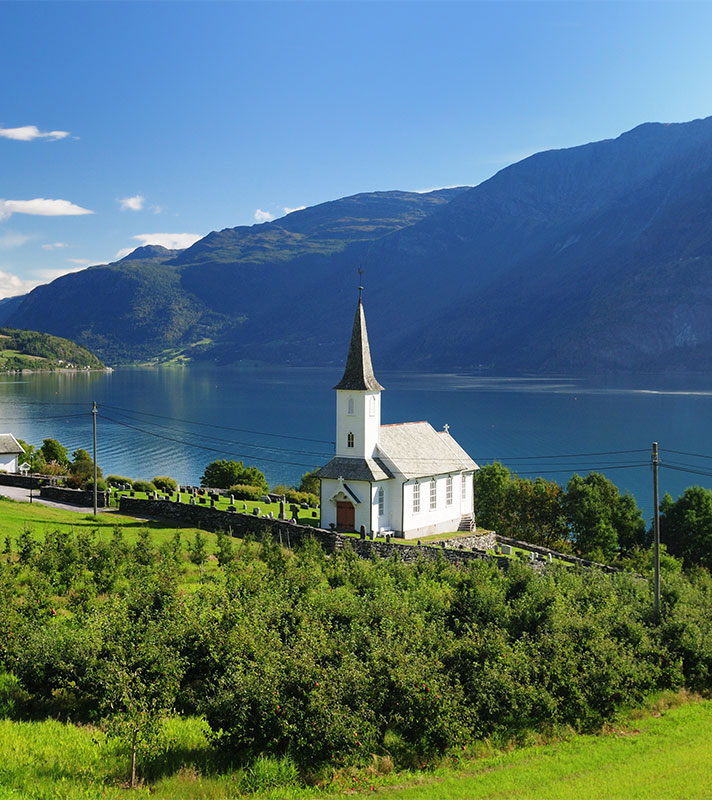 View To Lustrafjord With A White Wooden Chapel, Norway