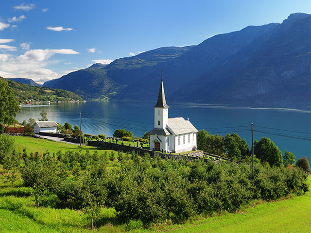 View To Lustrafjord With A White Wooden Chapel, Norway