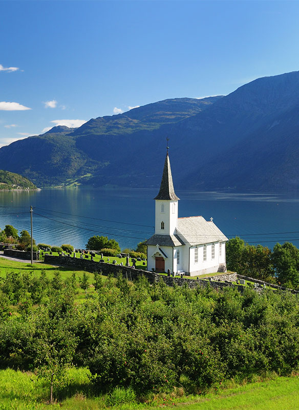 View To Lustrafjord With A White Wooden Chapel, Norway